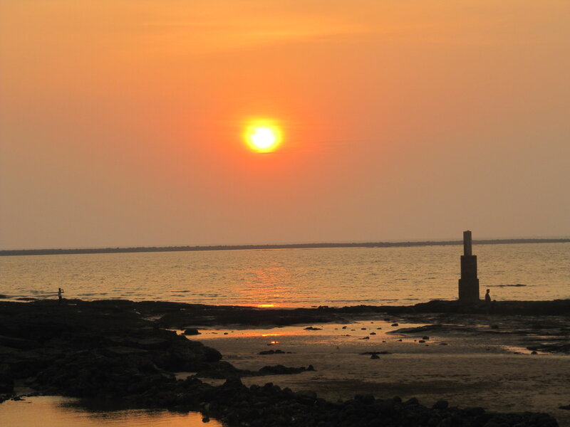 Silhouetted Figures on Shore — Orange, Serene