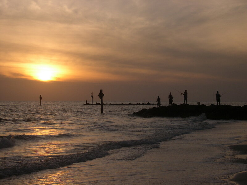Silhouetted Fishermen