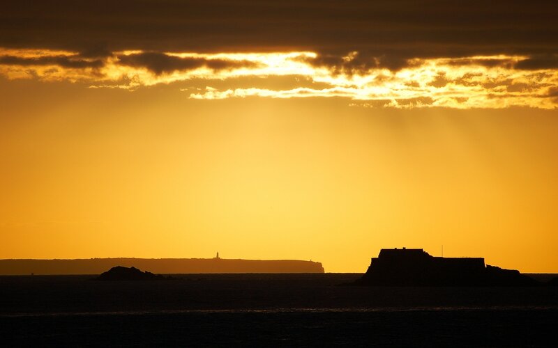 Silhouetted Fort at Sunset