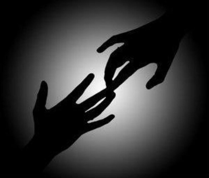 silhouetted hands reaching