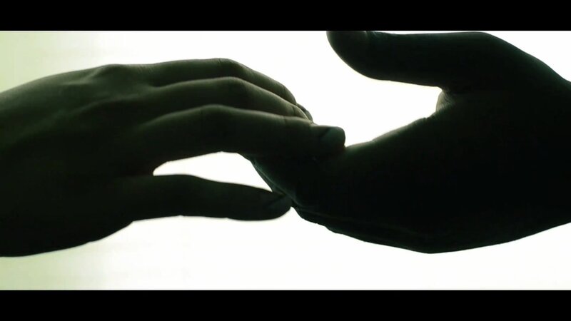Silhouetted Hands Touching