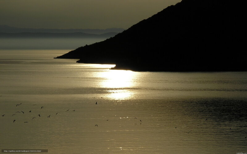 Silhouetted Hill over Water