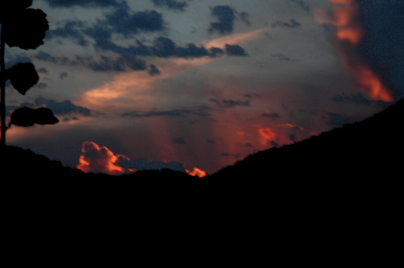 Silhouetted Hills at Dusk — Orange, Dramatic