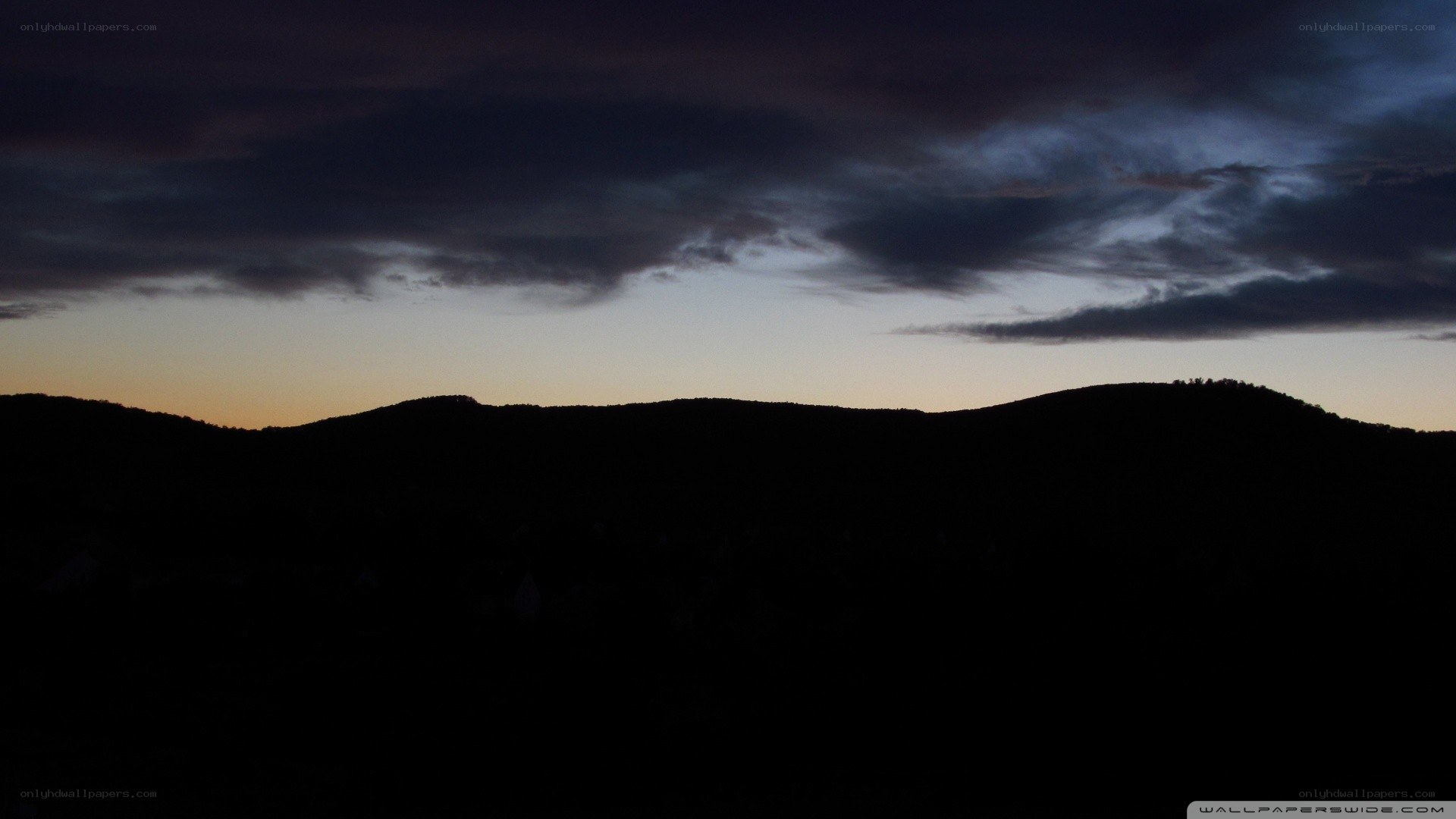 Silhouetted hills at dusk