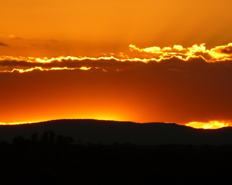 Silhouetted Hills at Sunset — Clouds