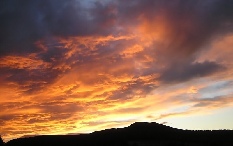 Silhouetted Hills at Sunset — Orange, Dramatic, Photograph, Clouds, Sky, Yellow