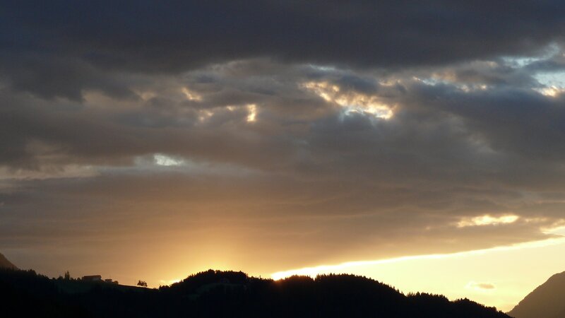 Silhouetted Hills at Sunset — Orange, Dramatic, Photograph, Clouds, Sunlight