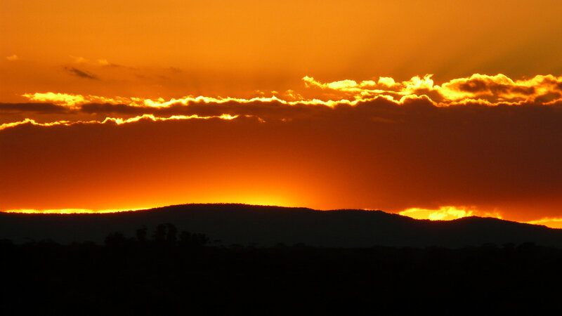 Silhouetted Hills at Sunset — Orange, Dramatic