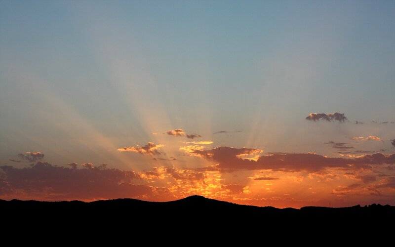Silhouetted Hills at Sunset — Orange, Serene, Photograph, Clouds