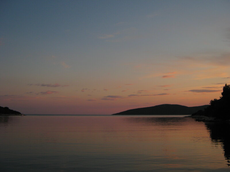 Silhouetted Hills at Sunset — Orange, Serene, Photograph