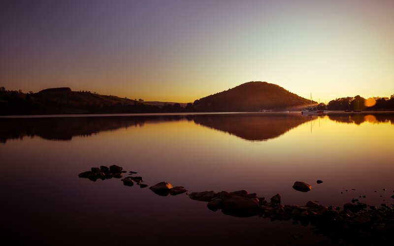 Silhouetted Hills at Sunset — Purple, Serene