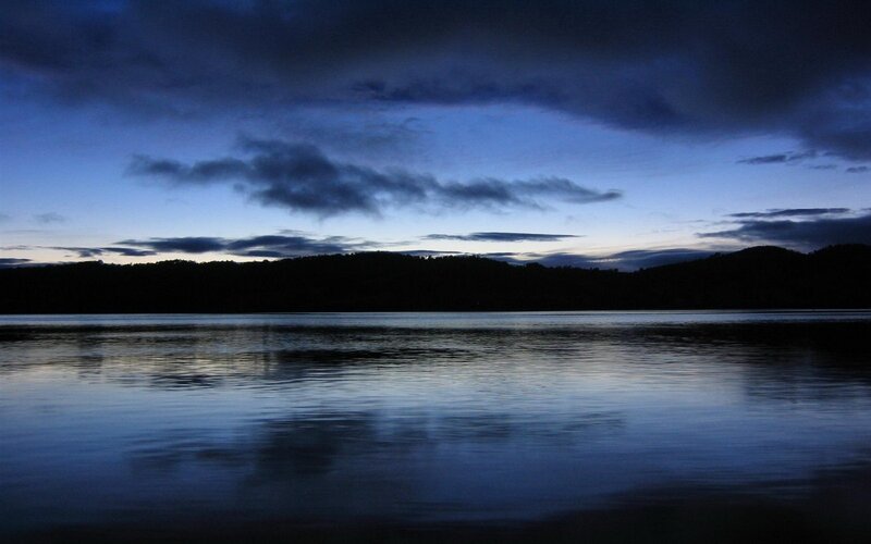 Silhouetted Hills over Lake — Blue, Serene