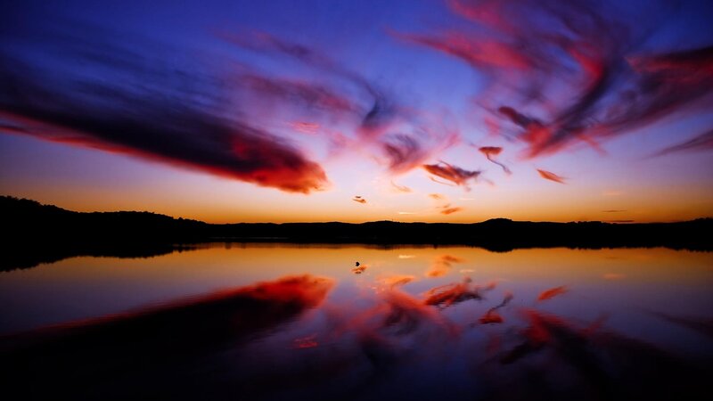 Silhouetted Hills over Lake — Blue