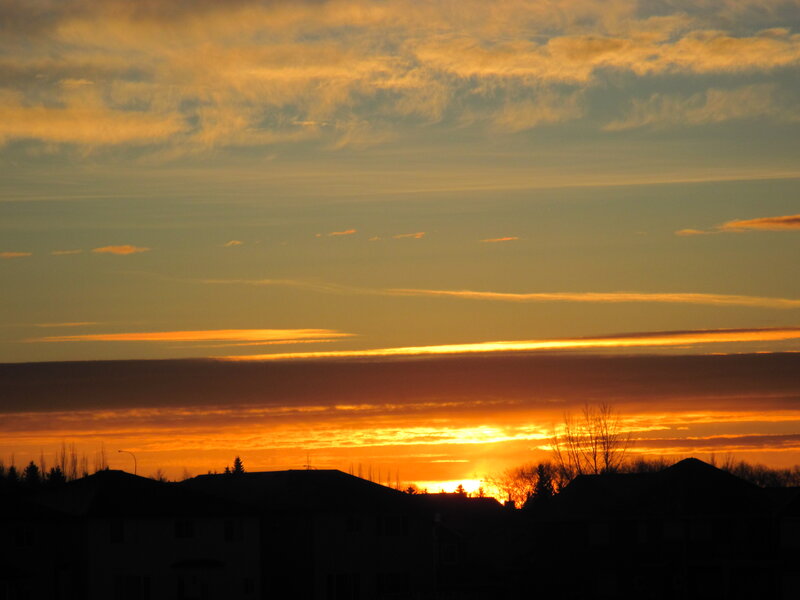 Silhouetted Houses at Sunset — Orange, Dramatic, Photograph