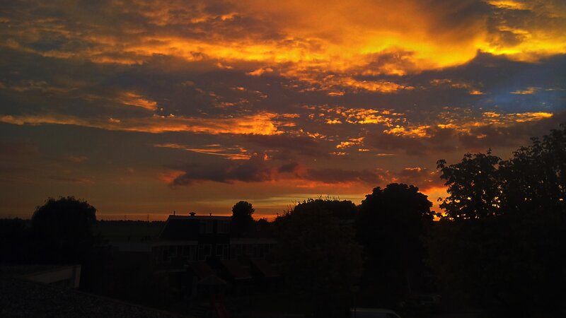 Silhouetted Houses at Sunset — Orange, Dramatic, Photograph, Trees, Clouds