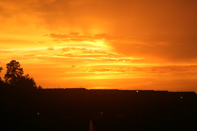 Silhouetted Houses at Sunset — Orange, Dramatic
