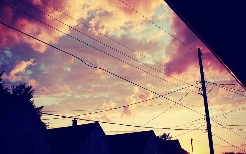 Silhouetted Houses at Sunset — Purple, Dramatic