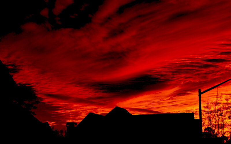 Silhouetted Houses at Sunset — Red, Dramatic