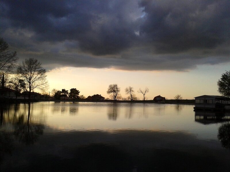 Silhouetted Houses by Lake — Gray