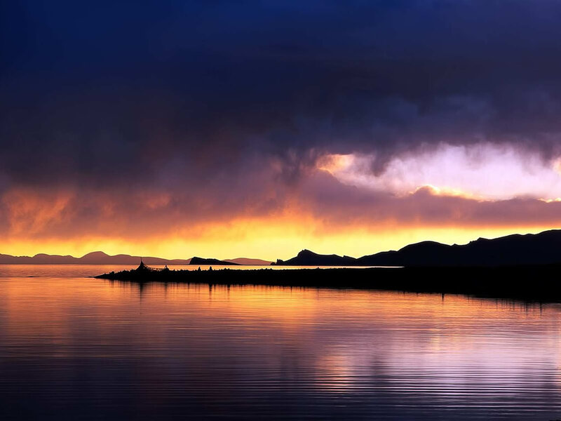 Silhouetted Island at Sunset — Orange, Dramatic, Photograph, Mountains, Sky, Water, Purple