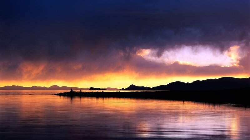 Silhouetted Island at Sunset — Orange, Dramatic