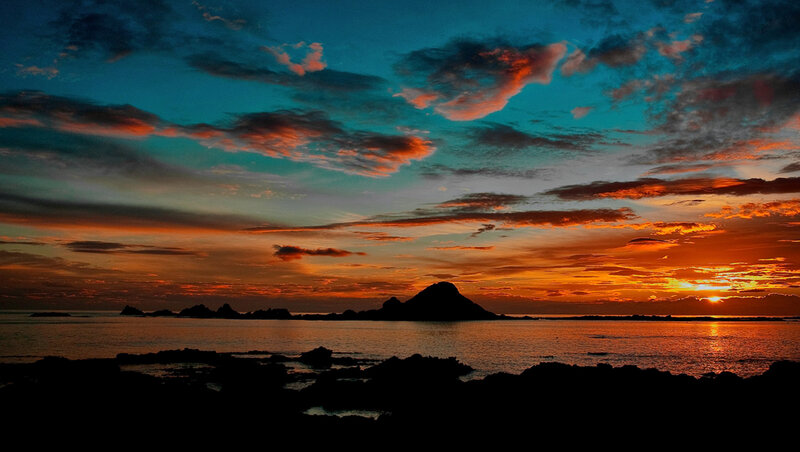 Silhouetted Island at Sunset — Orange