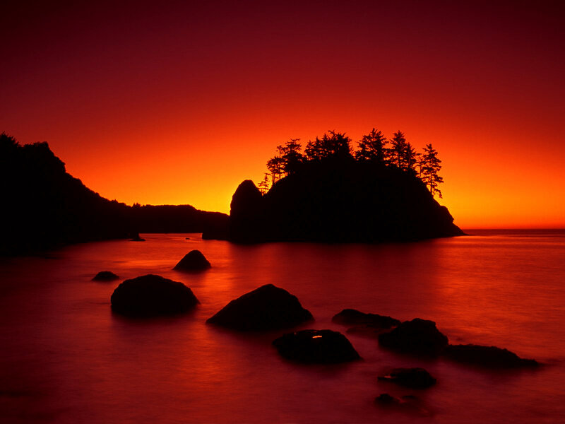 Silhouetted Island at Sunset — Red, Dramatic, Photograph