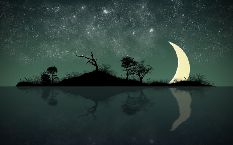 Silhouetted Island under Moon