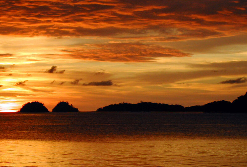 Silhouetted Islands at Sunset — Orange