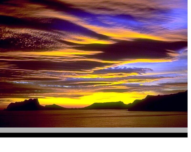 Silhouetted Islands at Sunset — Yellow, Dramatic