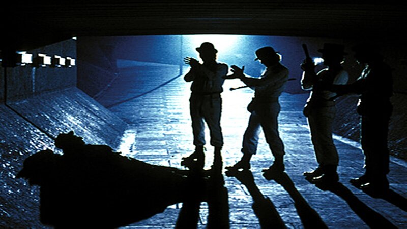 Silhouetted Men in Tunnel