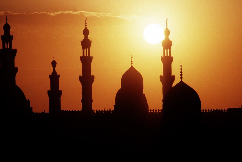 Silhouetted mosque at sunset