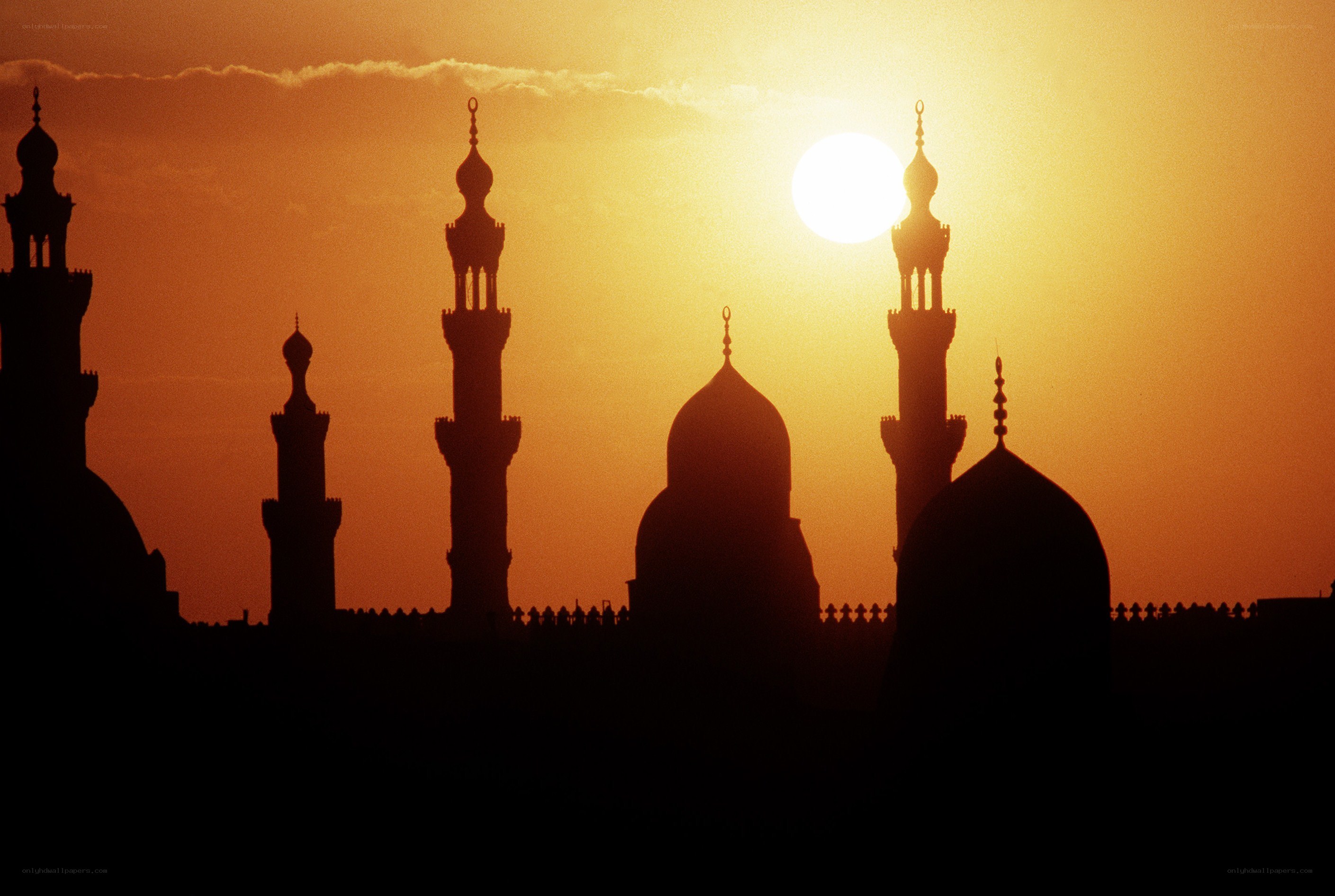 Silhouetted mosque at sunset