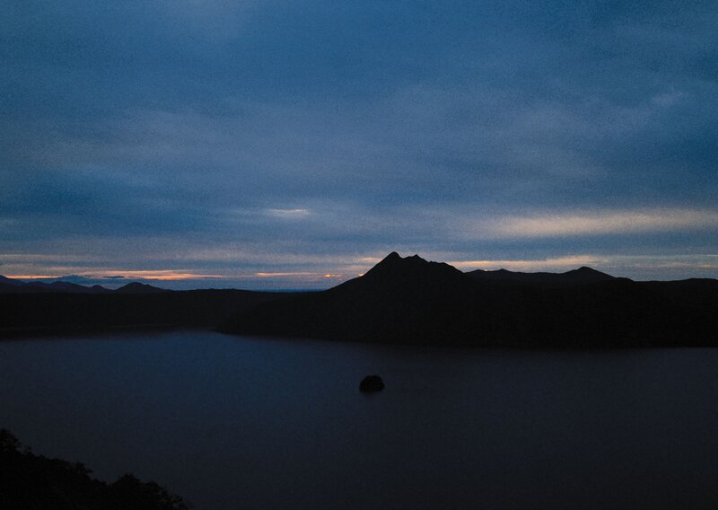 Silhouetted mountain at dusk