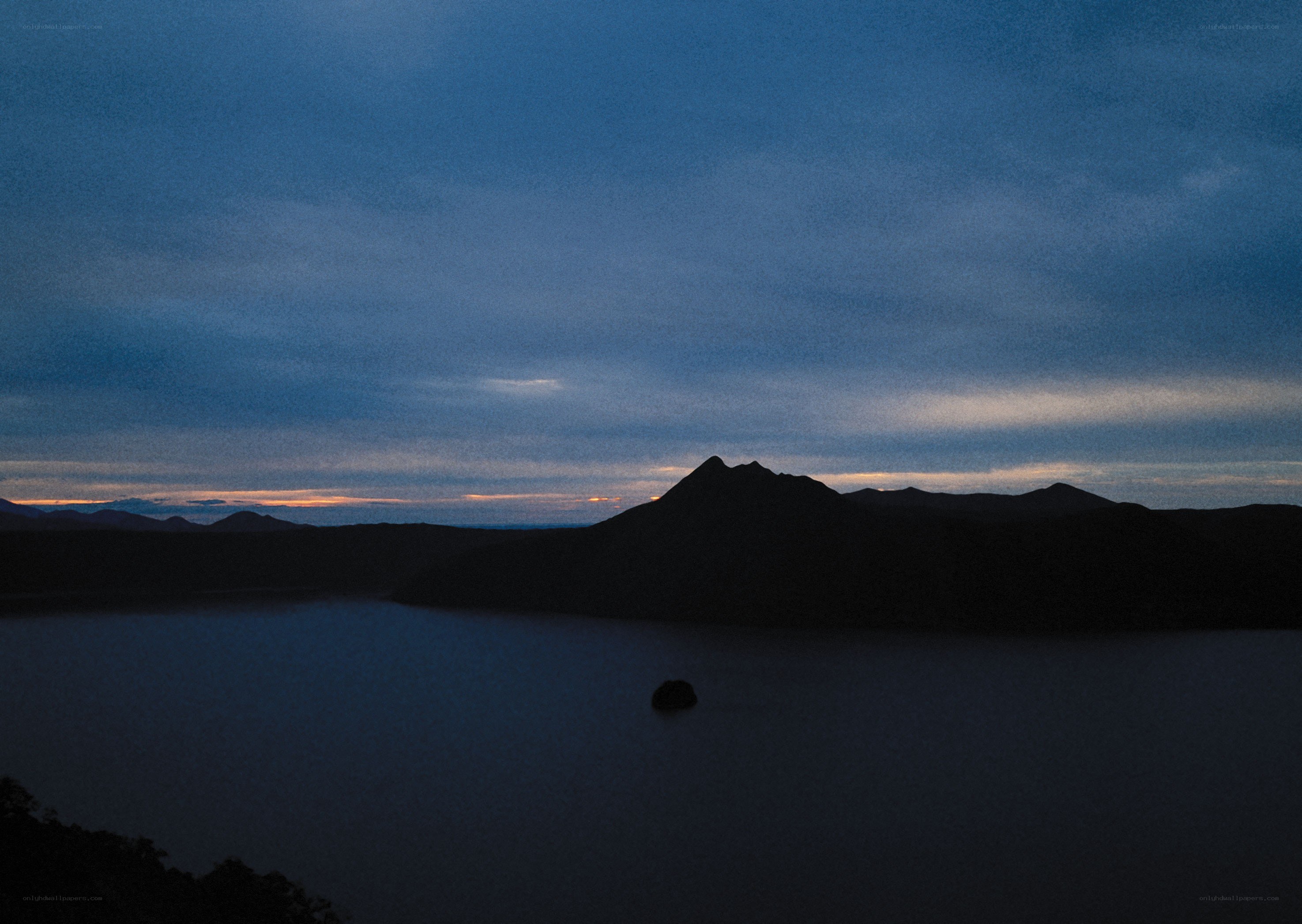 Silhouetted mountain at dusk
