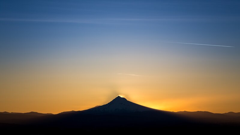 Silhouetted Mountain Peak — Blue