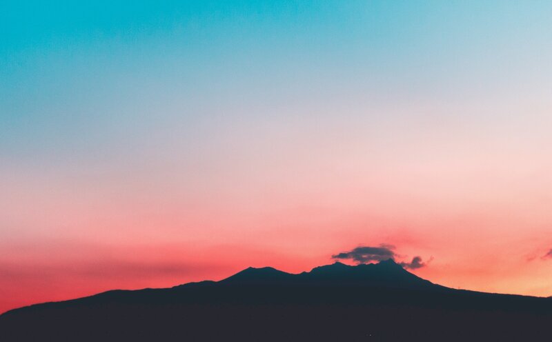 Silhouetted Mountain Range — Blue