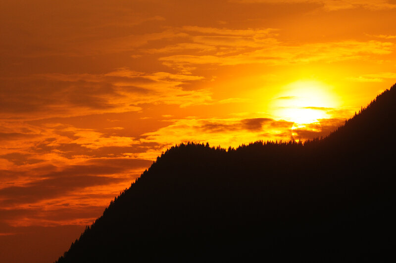 Silhouetted Mountain Range — Orange, Dramatic