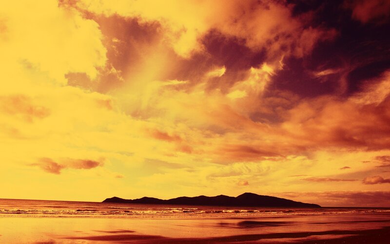 Silhouetted Mountains at Beach