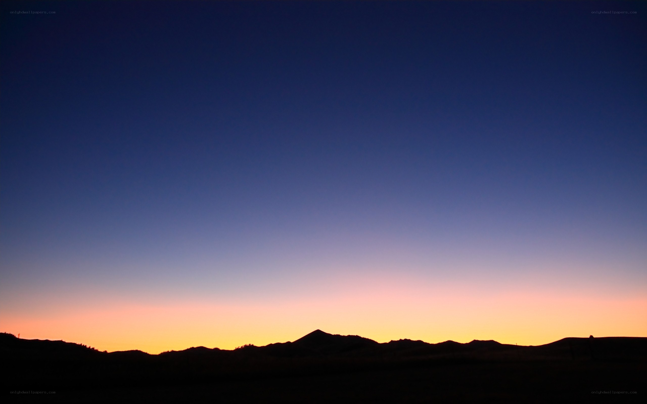 Silhouetted mountains at dusk