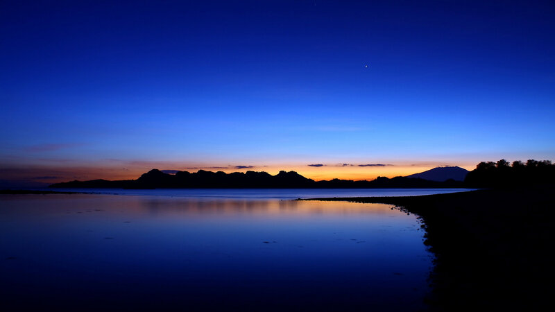 Silhouetted Mountains at Dusk — Blue