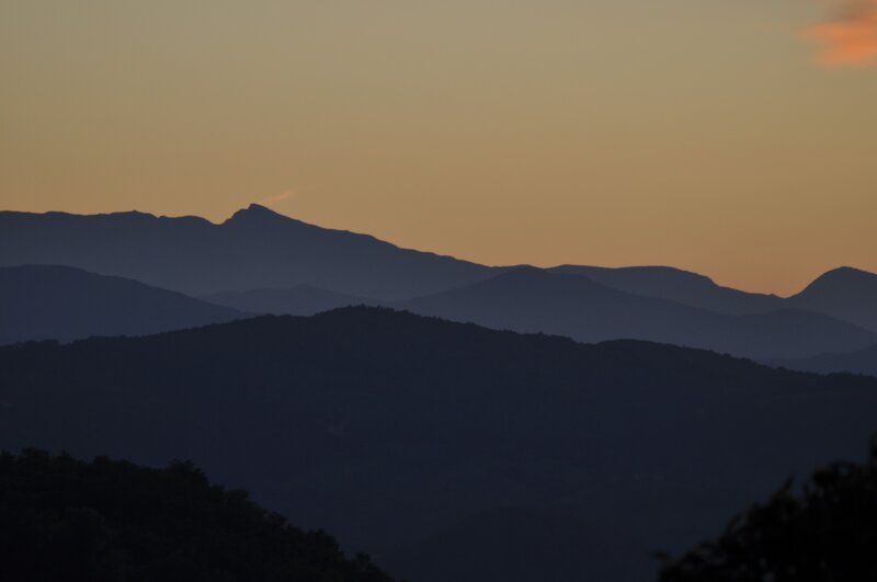 Silhouetted Mountains at Dusk — Orange, Serene