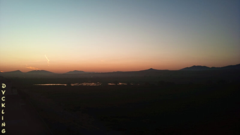 Silhouetted Mountains at Dusk — Orange