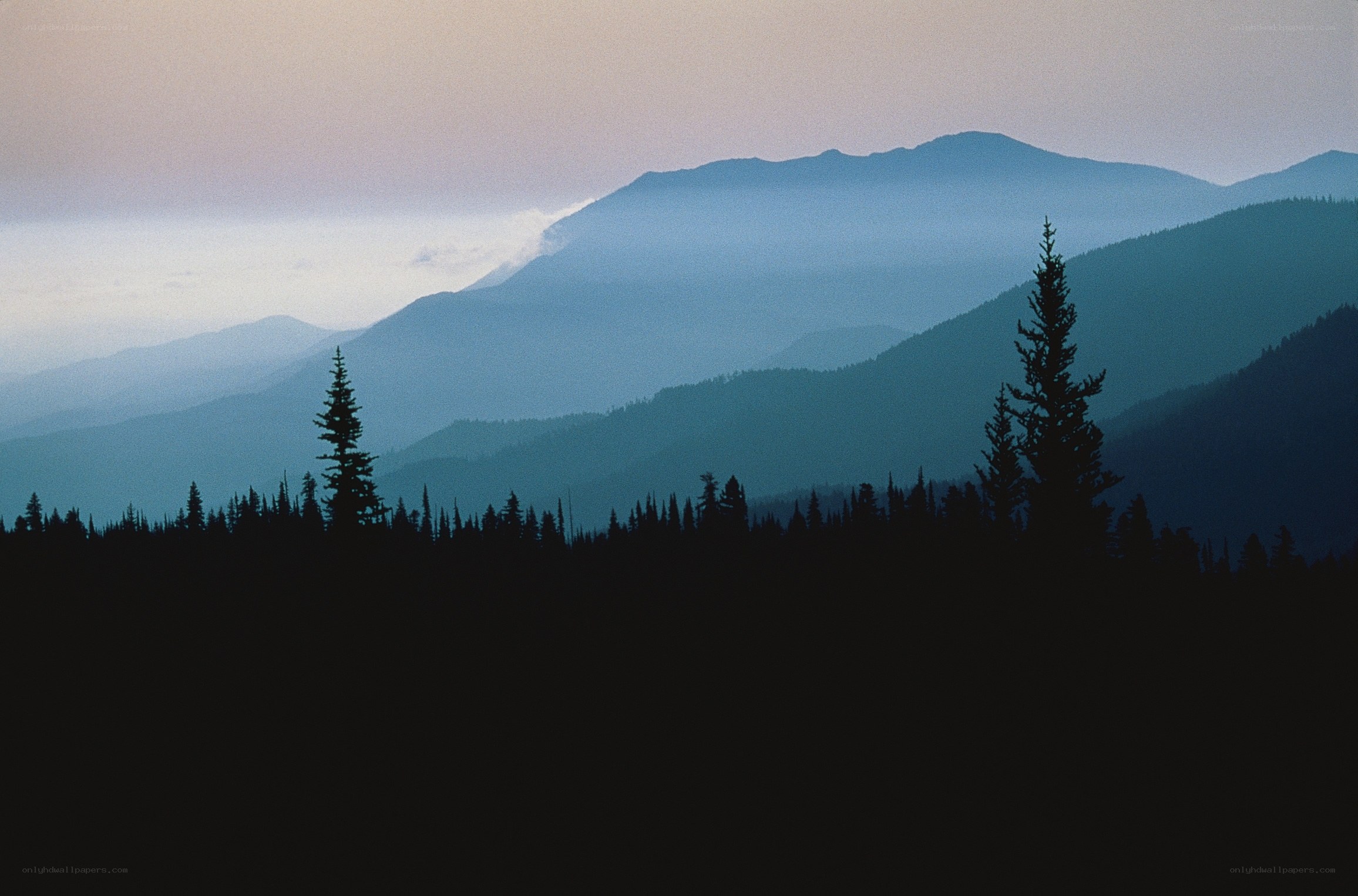 Silhouetted mountains at dusk