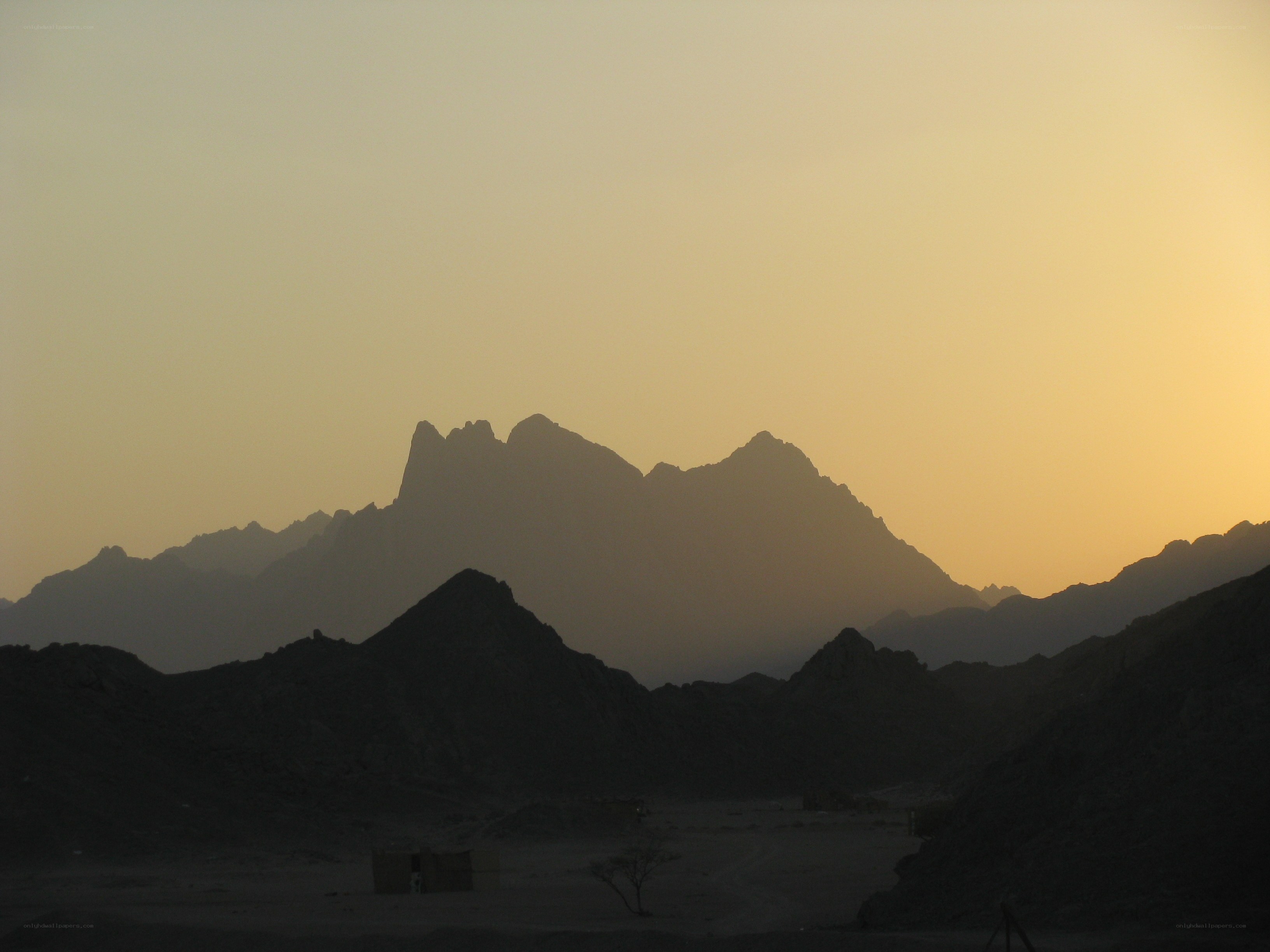 Silhouetted mountains at sunset
