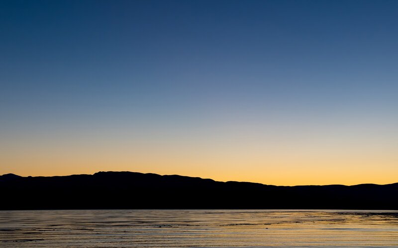 Silhouetted Mountains at Sunset — Blue, Serene, Photograph