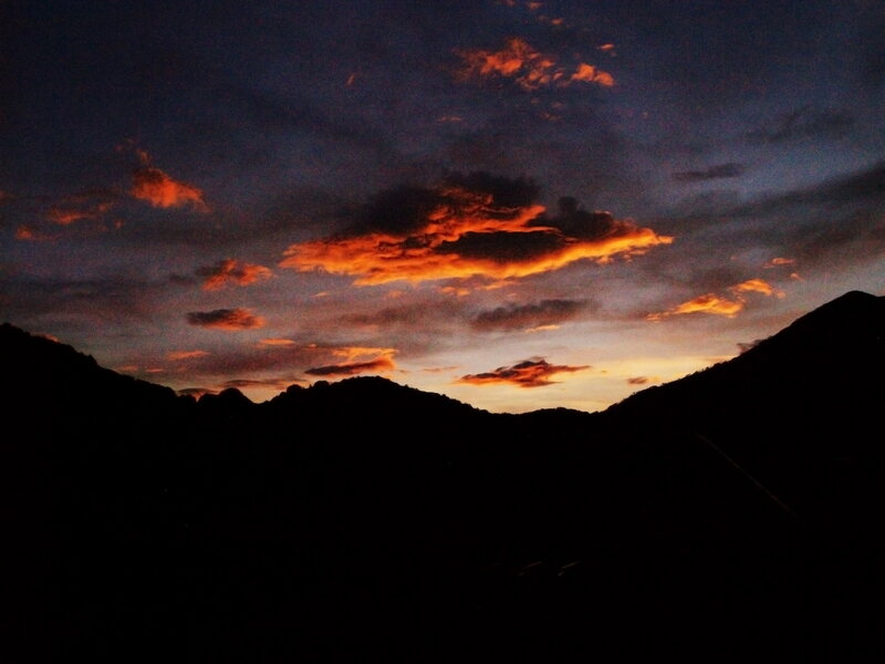 Silhouetted Mountains at Sunset — Orange, Dramatic, Photograph, Clouds, Sky
