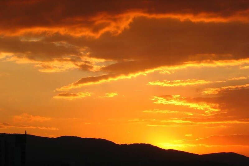 Silhouetted Mountains at Sunset — Orange, Dramatic, Photograph, Clouds