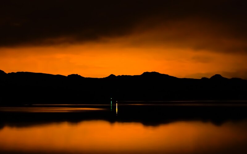 Silhouetted Mountains at Sunset — Orange, Dramatic, Photograph, Lake, Buoy