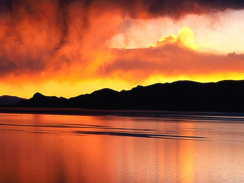 Silhouetted Mountains at Sunset — Orange, Dramatic